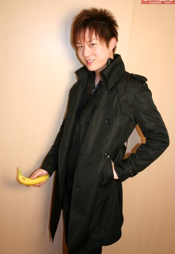 Cute Korean boy playing with his banana